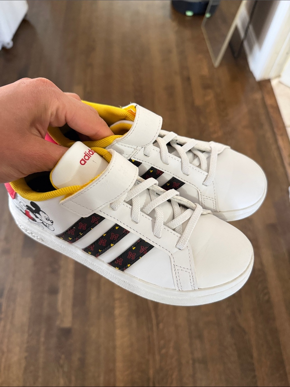 adidas Kids White Sneakers with Yellow Lining and Black Stripe Accents